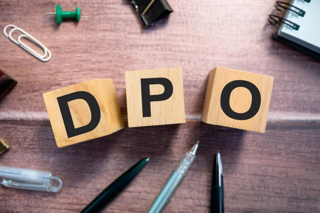 DPO Text on Wooden Block